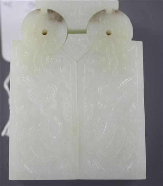 A Chinese archaistic pale celadon jade vessel or instrument, 9.5cm